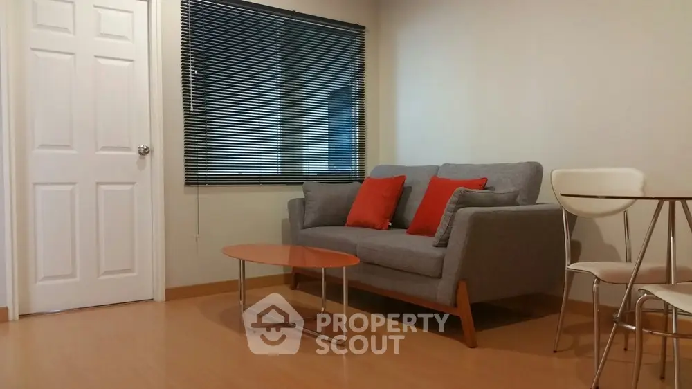 Cozy living room with modern sofa and stylish decor in a bright apartment.