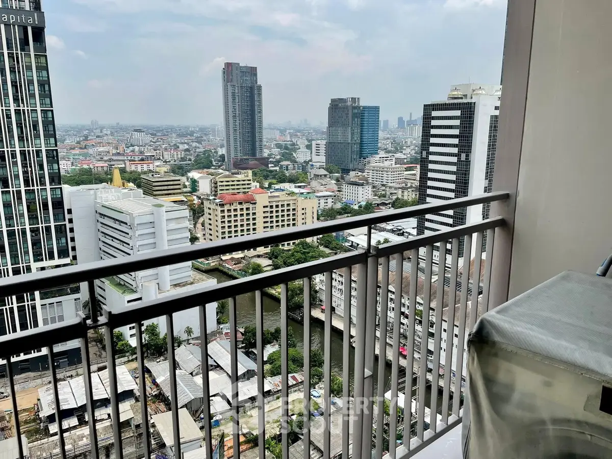 Stunning cityscape view from high-rise balcony in urban setting.