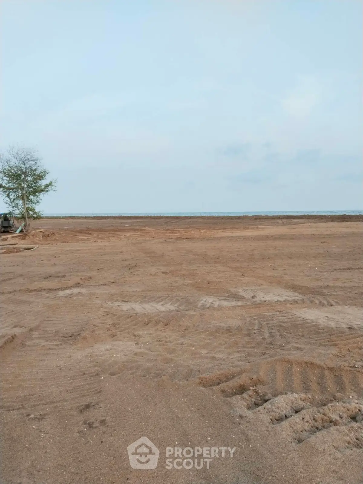 Expansive vacant land with potential for development, offering serene views and ample space for creative projects.