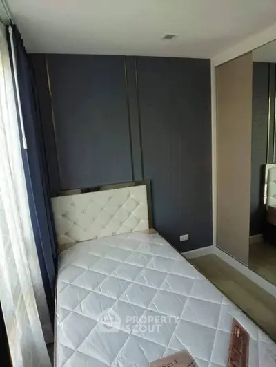 Modern bedroom with stylish decor and large mirror closet