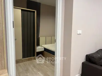 Modern bedroom with stylish wardrobe and cozy bed in a contemporary apartment.