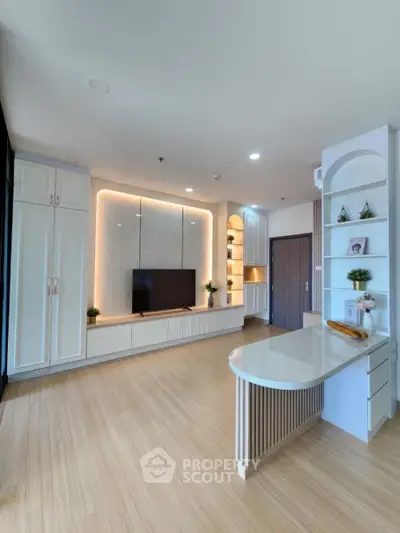 Modern living room with built-in TV unit and stylish decor