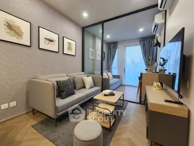 Modern living room with stylish decor and large windows for natural light