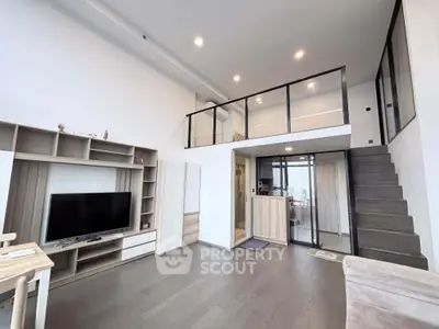 Modern loft-style living room with mezzanine and sleek interior design