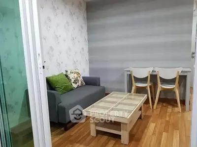 Charming living room with modern decor and cozy seating area, perfect for relaxation and entertaining.