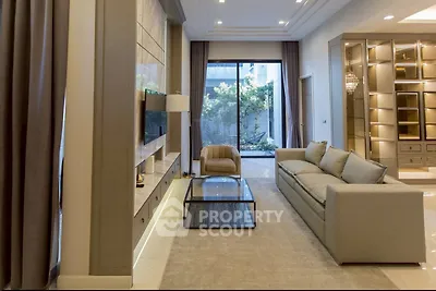Luxurious living room with modern decor and garden view