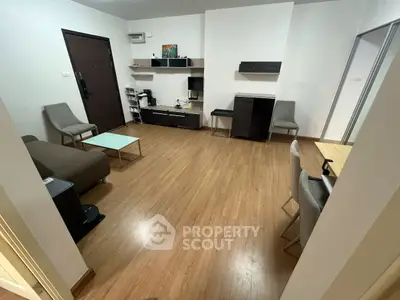 Modern living room with wooden flooring and stylish furniture