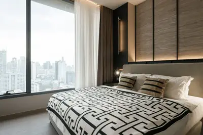 Luxurious bedroom with city view and modern decor