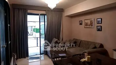 Cozy living room with elegant chandelier and stylish decor