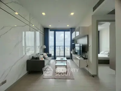 Modern living room with city view, sleek design and cozy ambiance