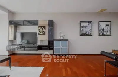 Spacious modern living room with sleek furniture and hardwood floors