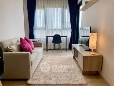 Modern living room with cozy sofa, stylish decor, and natural light.