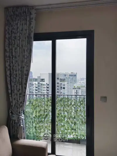 Modern apartment balcony with city view and elegant curtains