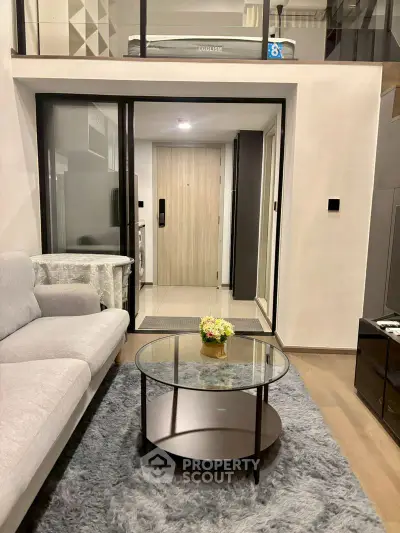 Modern living room with stylish furniture and loft design in a contemporary apartment.
