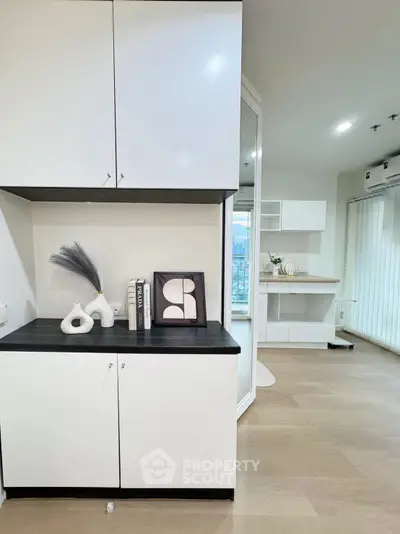 Modern interior with sleek cabinets and stylish decor in a bright living space.