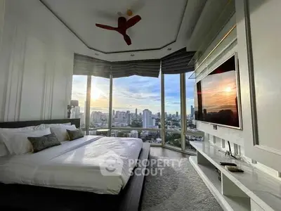 Luxurious bedroom with panoramic city views and modern decor