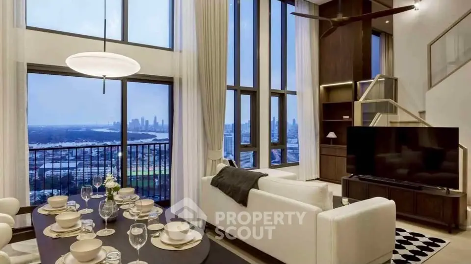 Luxurious living room with stunning city view, high ceilings, and elegant decor in a modern apartment.