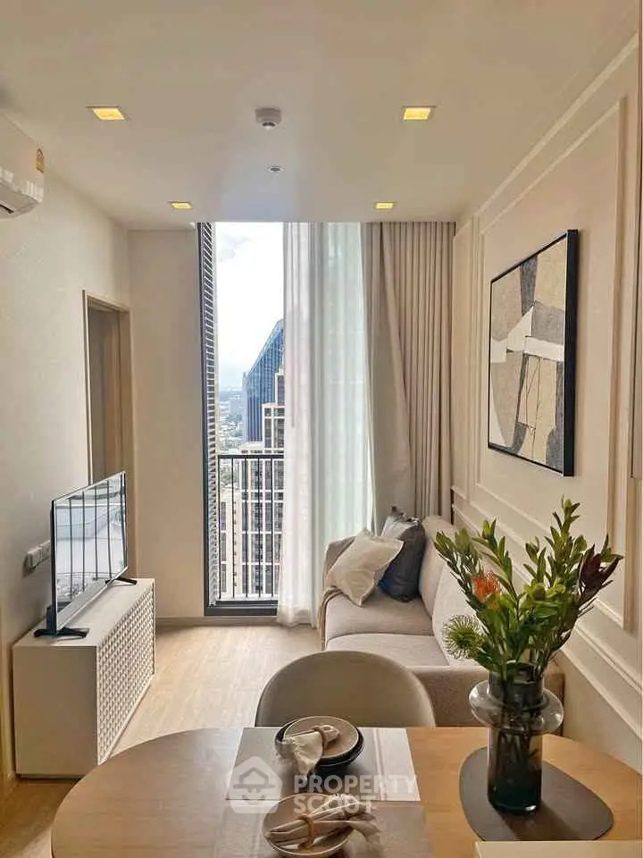 Modern living room with large window and stylish decor in high-rise apartment