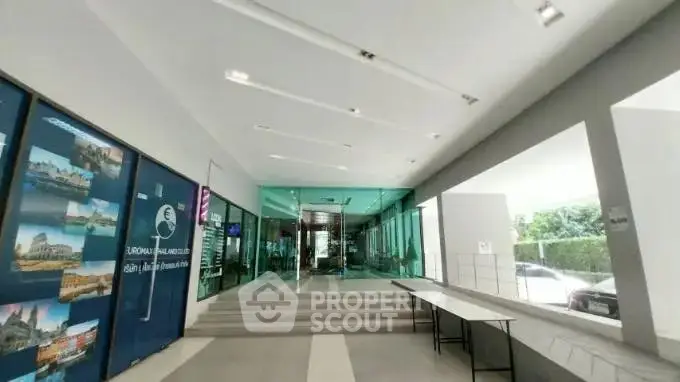 Modern building entrance with sleek design and glass doors