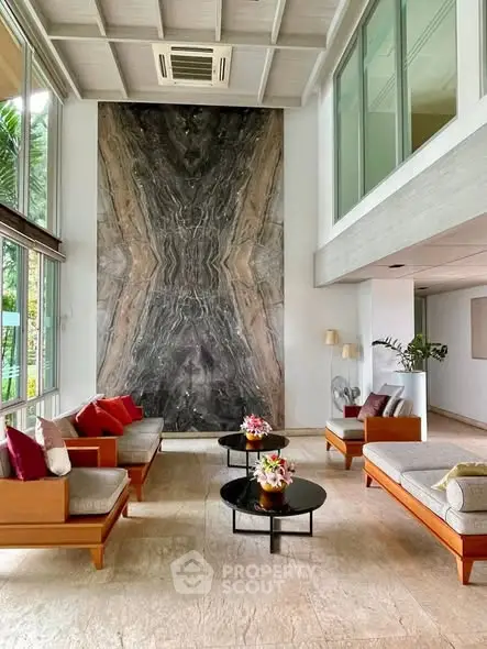 Luxurious living room with high ceiling and elegant decor