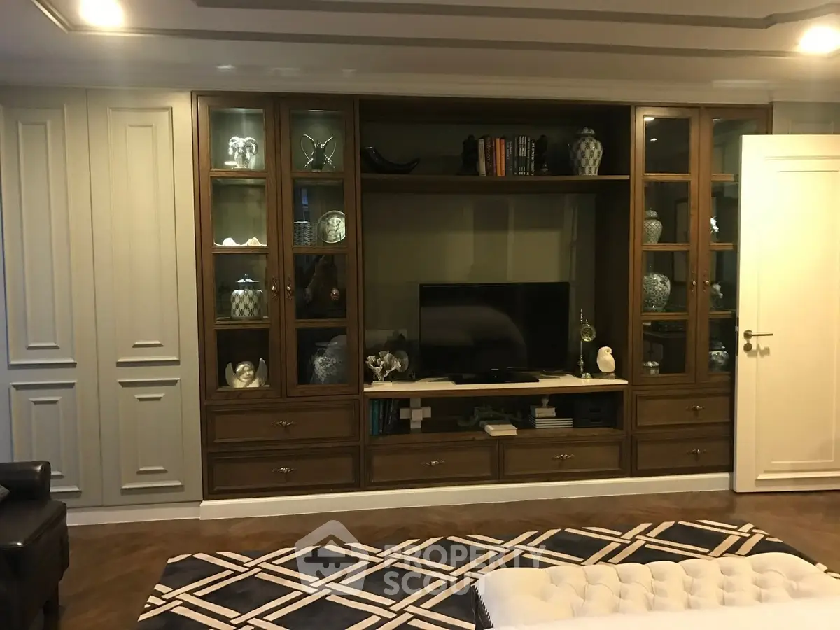 Elegant living room with built-in wooden shelves and modern decor