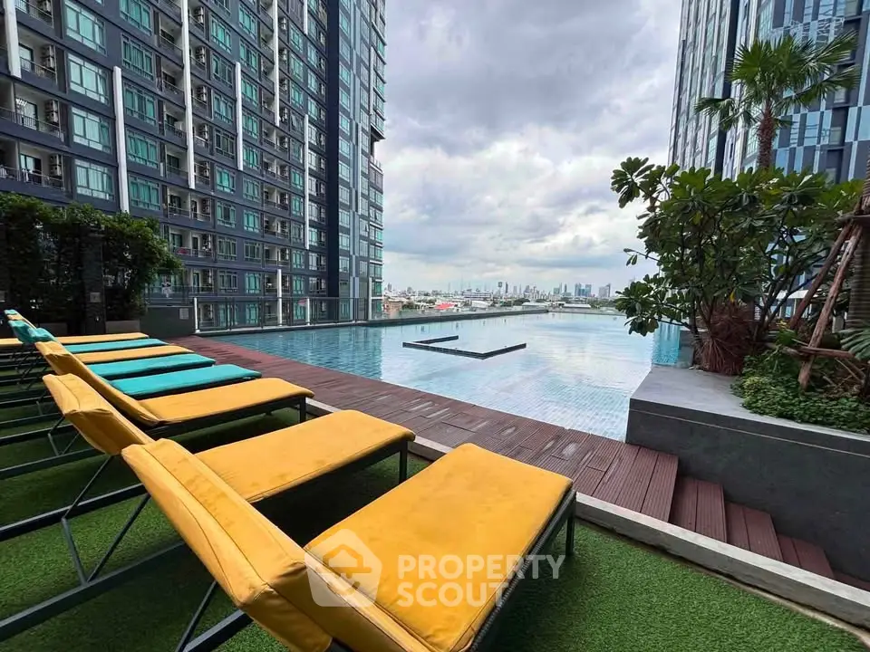Luxurious rooftop pool with city skyline view in modern high-rise building