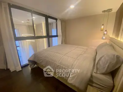 Luxurious bedroom with modern lighting and elegant decor