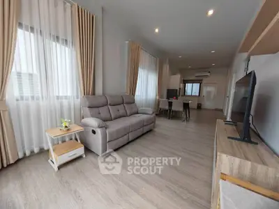 Spacious modern living room with elegant decor and natural light