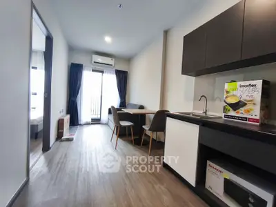 Modern apartment interior with sleek kitchen and cozy dining area