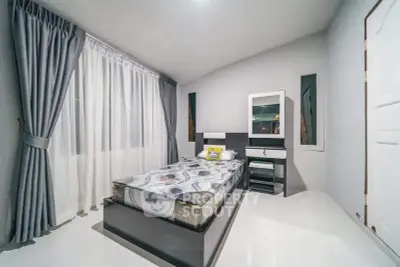 Modern bedroom with sleek design and ample natural light
