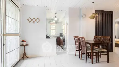 Charming open-layout dining area with modern kitchen and stylish decor