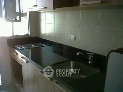 Modern kitchen with sleek countertops and ample cabinet space