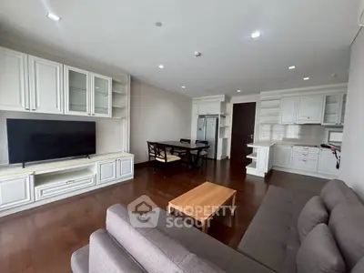Spacious open-plan living room with modern kitchen and elegant furnishings.