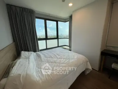 Spacious bedroom with stunning city view and modern decor