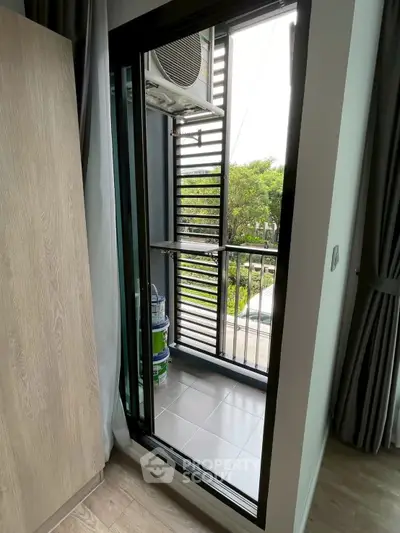 Modern balcony with sleek railing and urban view