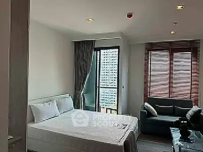 Modern bedroom with balcony view in high-rise apartment