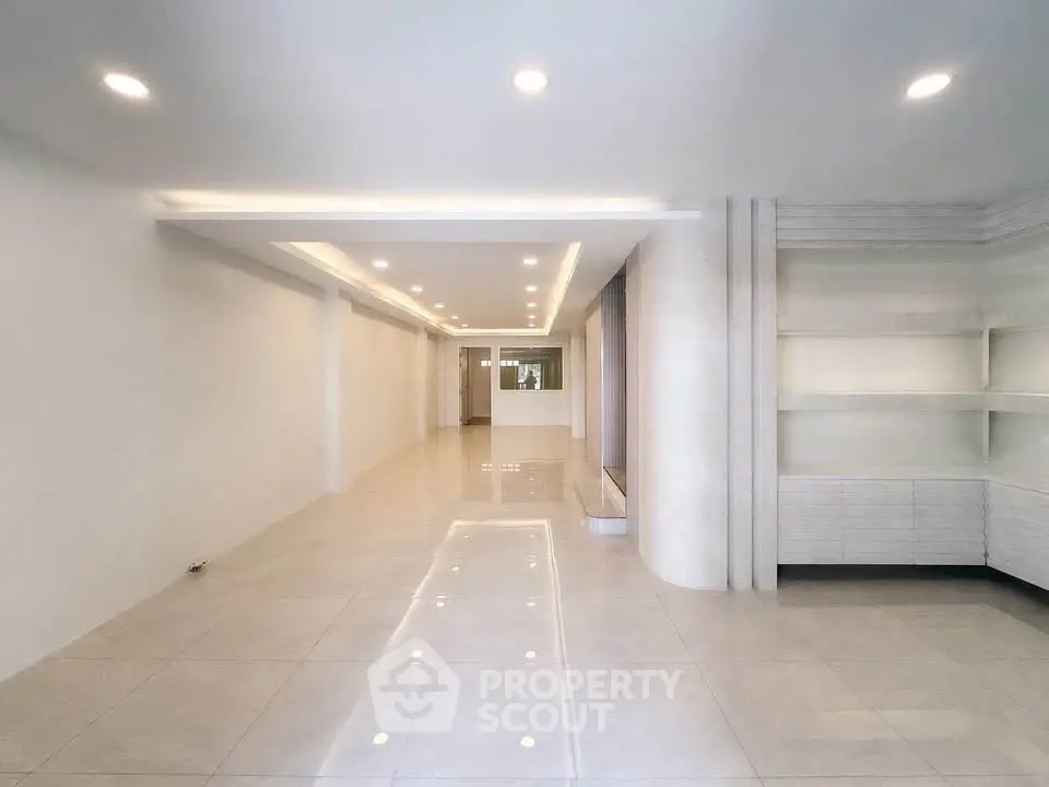 Spacious modern interior with elegant lighting and sleek tile flooring