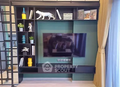 Modern living room with stylish TV unit and decorative shelving