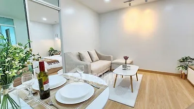 Modern living room with cozy sofa and dining area in stylish apartment