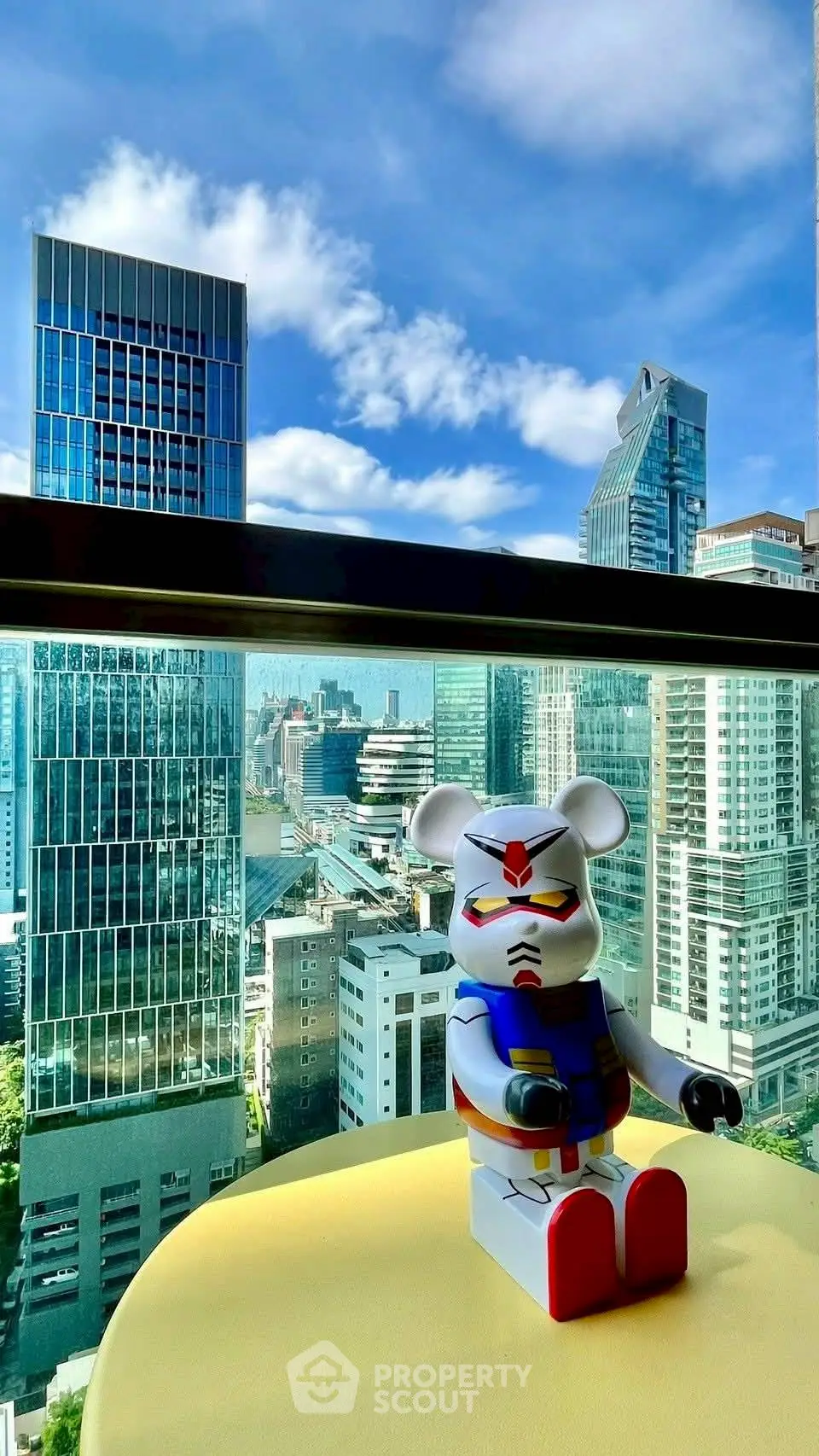 Stunning cityscape view from a high-rise balcony with modern architecture.