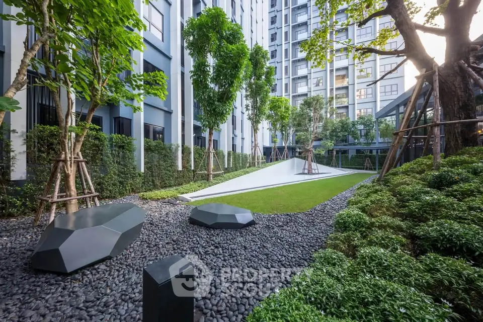 Modern residential building with lush garden and sleek landscaping