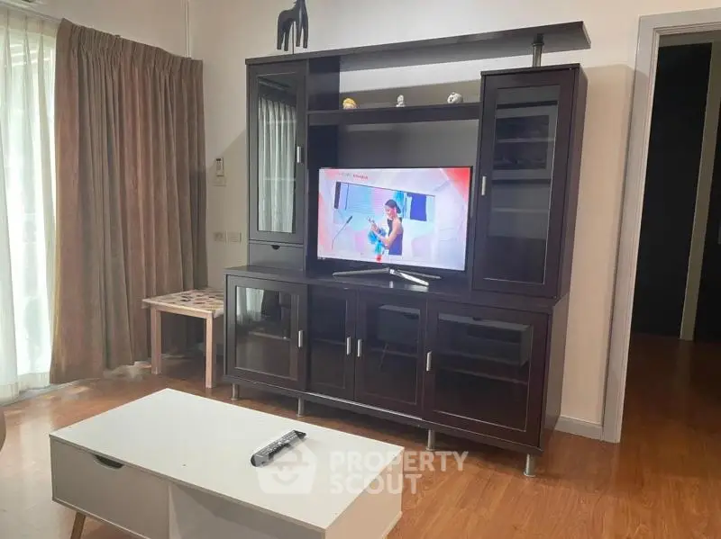 Stylish living room with modern entertainment center and sleek coffee table