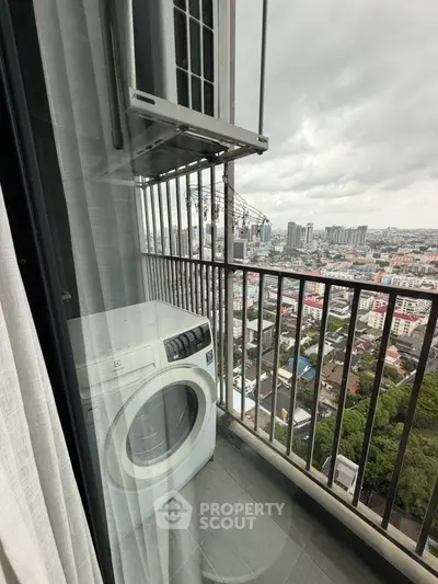 High-rise balcony with washing machine and stunning city view