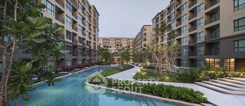 Luxurious apartment complex with stunning pool and lush landscaping