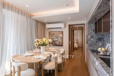 Elegant dining area with modern decor and natural light in a stylish apartment.