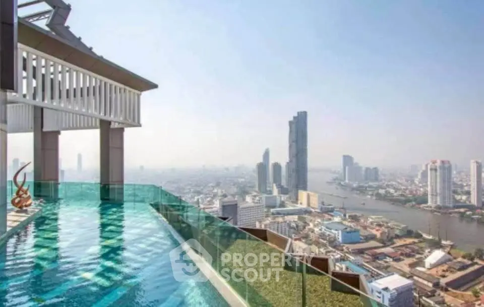 Stunning rooftop pool with breathtaking city skyline view, perfect for luxury urban living.