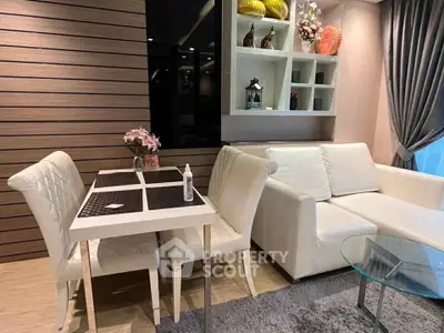 Modern living room with elegant dining set and cozy sofa, featuring stylish decor and soft lighting.