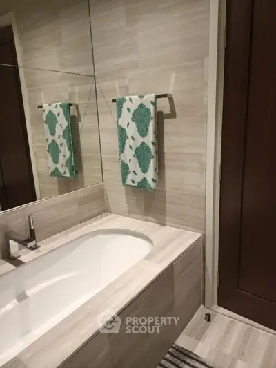 Modern bathroom with elegant bathtub and stylish decor