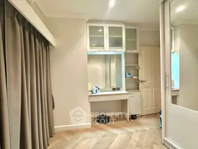 Modern bedroom with built-in storage and elegant wood flooring