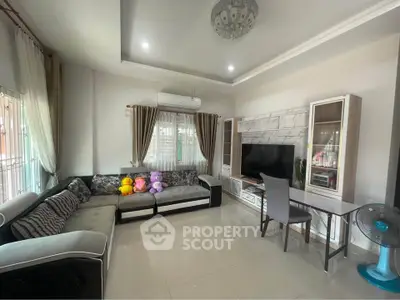 Spacious living room with modern furniture and large windows for natural light.